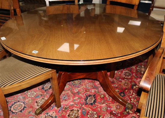 A circular dining table W.136cm